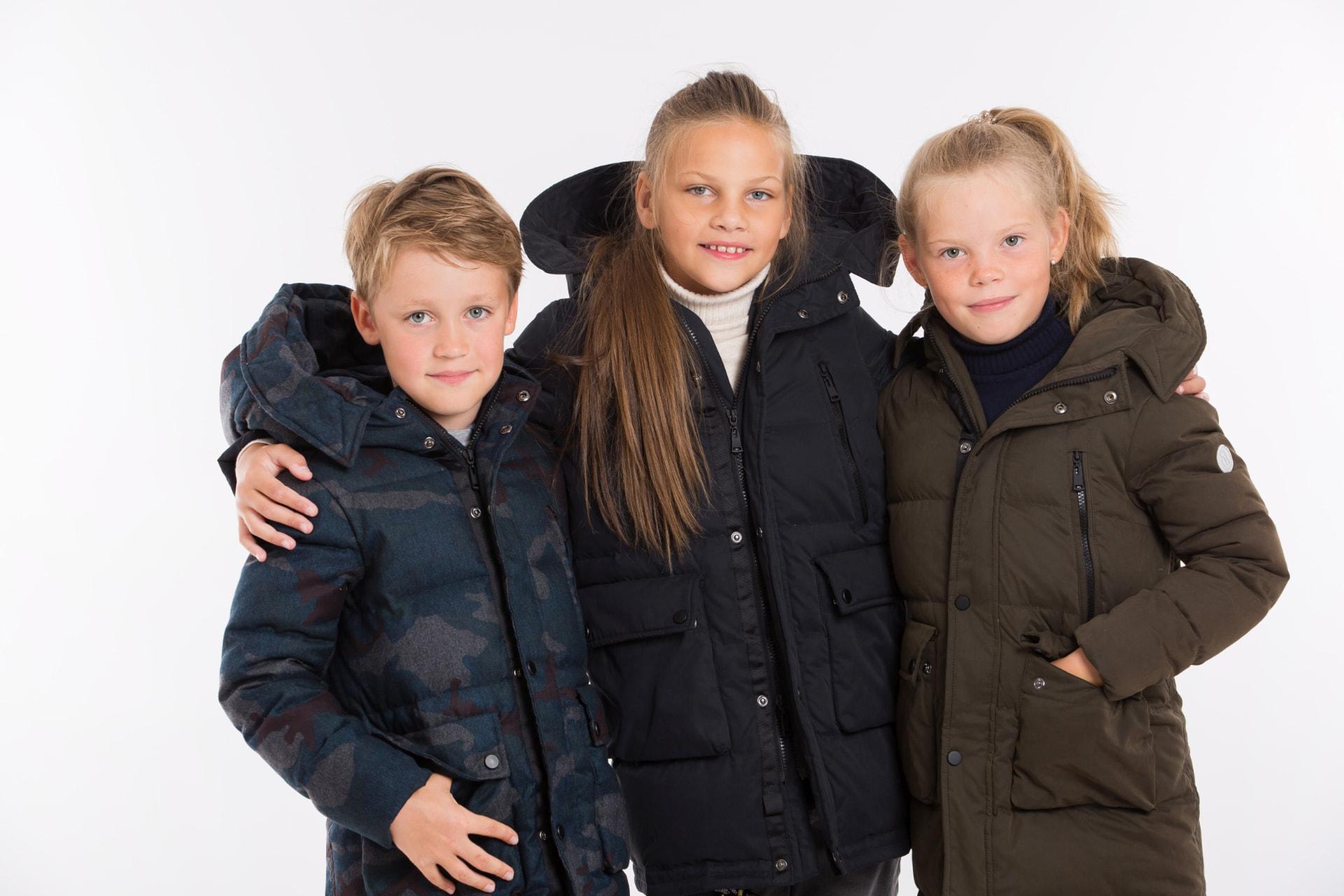Pengu KIDS winter collection: three children in down parkas and coats